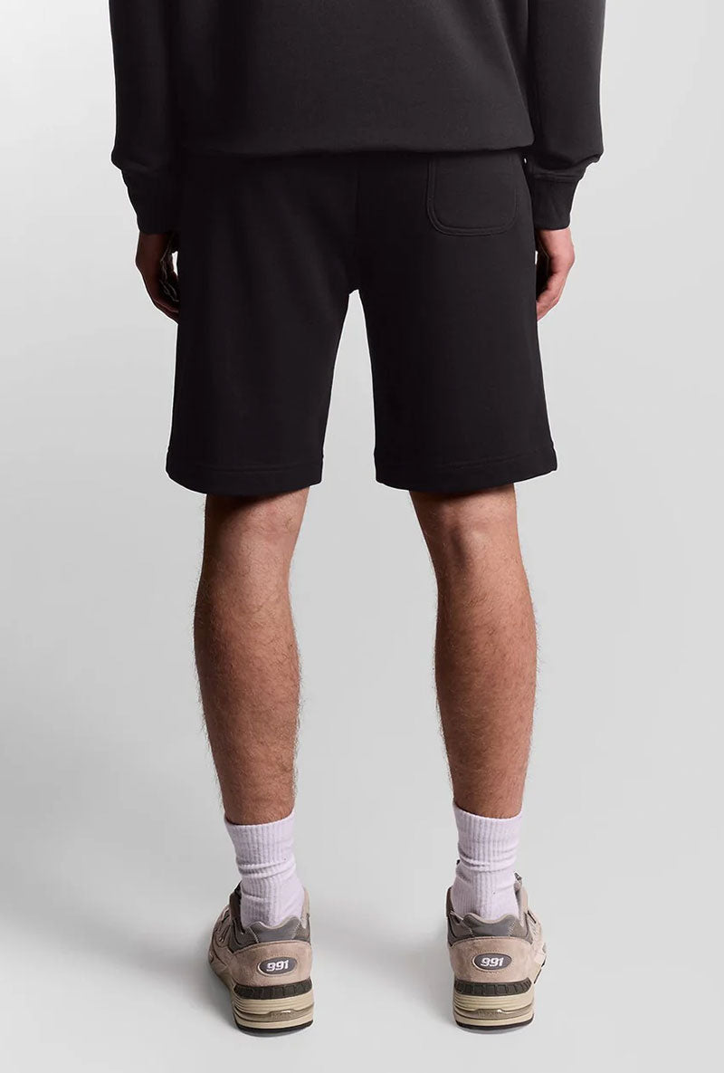 Back image of a model wearing Sweat shorts in black, by brand Lyle and scott