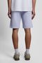 Back image of a model wearing the Sweat shorts in blue, by brand Lyle and scott