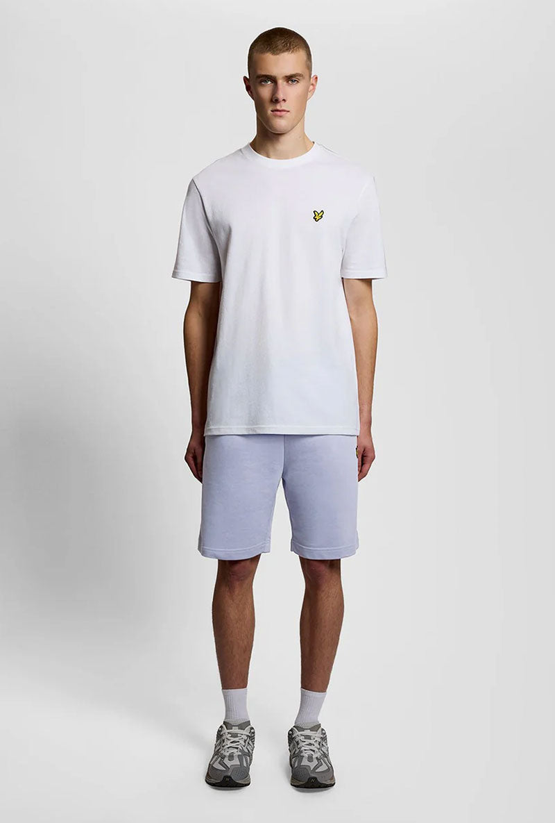 Front image of a model wearing Sweat shorts in blue, by brand Lyle and scott