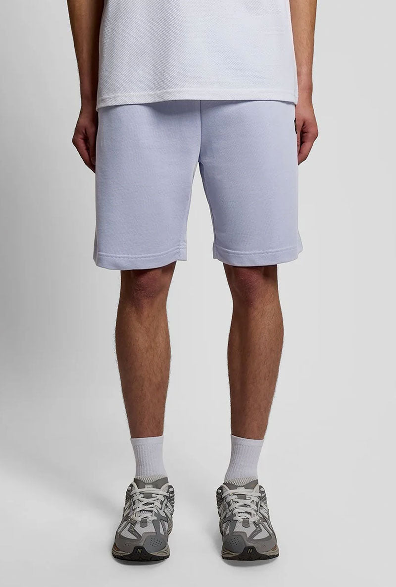 Front image of a model wearing Sweat shorts in blue, by brand Lyle and scott