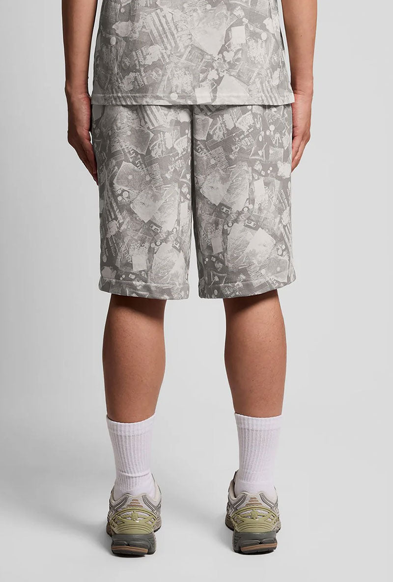 Back image of a model wearing Industrial print sweat shorts in grey, by brand Lyle and scott