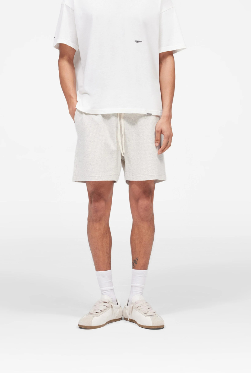 Front image of Micro owners club mesh shorts in cream, by brand Represent