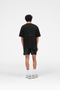 Back image of the Micro owners club tshirt in black, by brand Represent