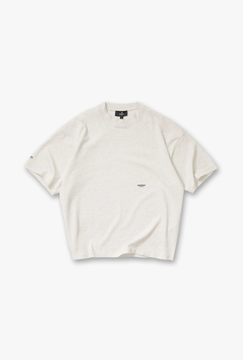Front image of Micro owners club tshirt in cream, by brand Represent
