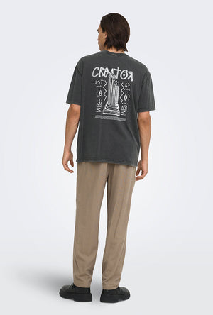 Back image of a model wearing the Fred creative washed tee in black, by brand Only and sons