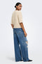 Back image of a model wearing the Bouble ss vneck button cardigan in stone, by brand Only