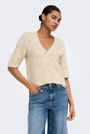 Front image of a model wearing the Bouble ss vneck button cardigan in stone, by brand Only