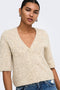Front image of a model wearing the Bouble ss vneck button cardigan in stone, by brand Only