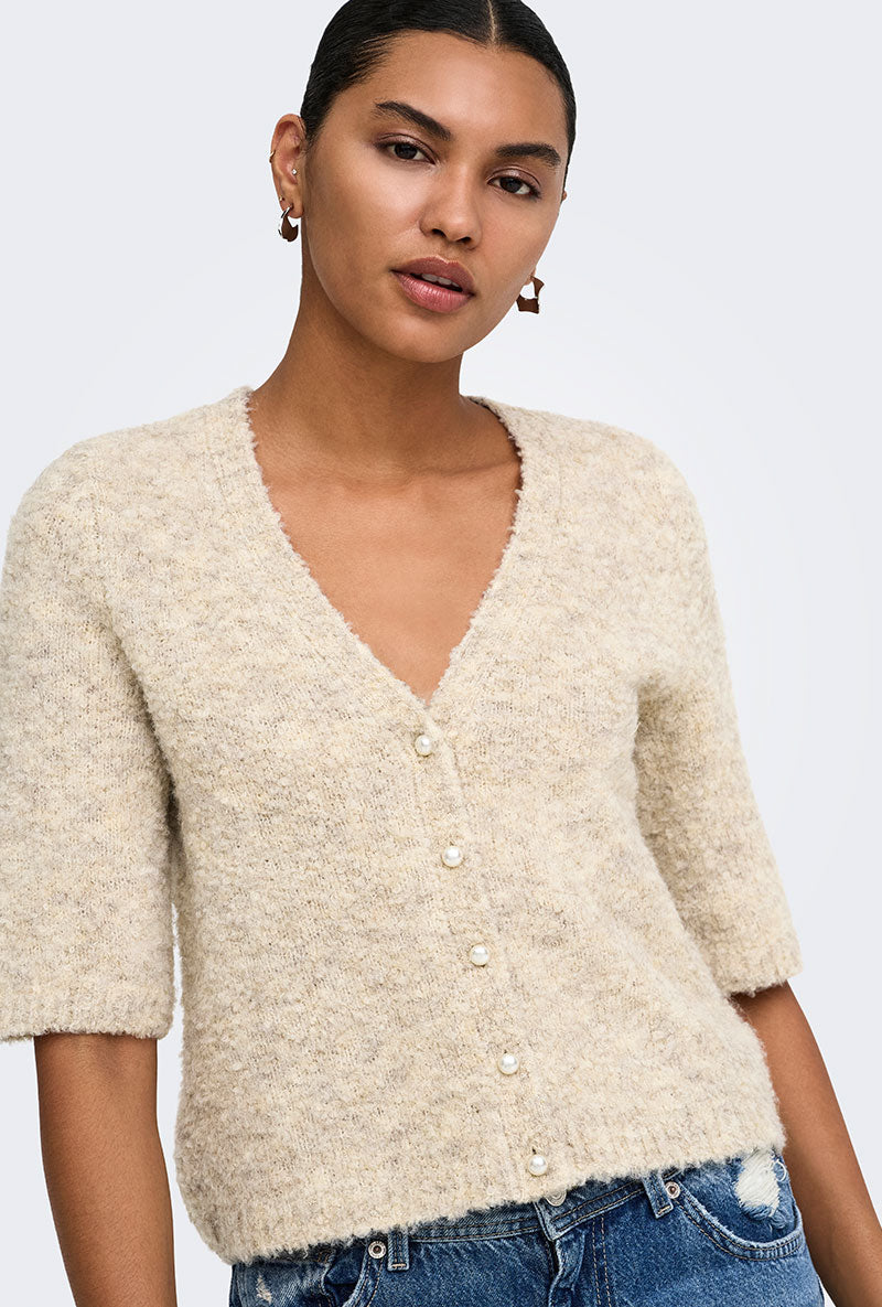 Front image of a model wearing Bouble ss vneck button cardigan in stone, by brand Only