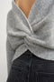 Back image of a model wearing the Cally knitted knot jumper in grey, by brand Top shop