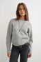 Front image of a model wearing Cally knitted knot jumper in grey, by brand Top shop