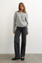 Front image of a model wearing the Cally knitted knot jumper in grey, by brand Top shop
