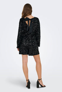 Back image of a model wearing the Confidence ls sequin bow top in black, by brand Only