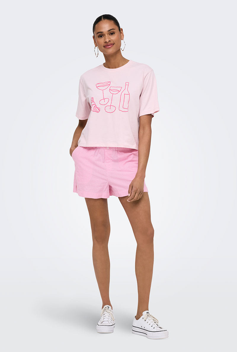 Front image of a model wearing Filucca hw pull up shorts in pink, by brand Only