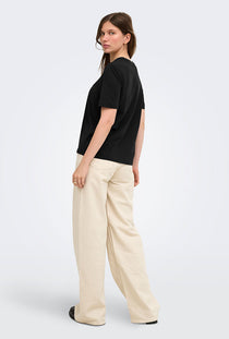 Back image of a model wearing the Happy ss oneck tee in black, by brand Only