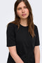 Front image of a model wearing the Happy ss oneck tee in black, by brand Only