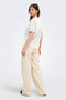 Back image of a model wearing the Happy ss oneck tee in off white, by brand Only