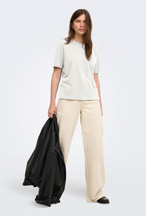 Front image of a model wearing the Happy ss oneck tee in off white, by brand Only