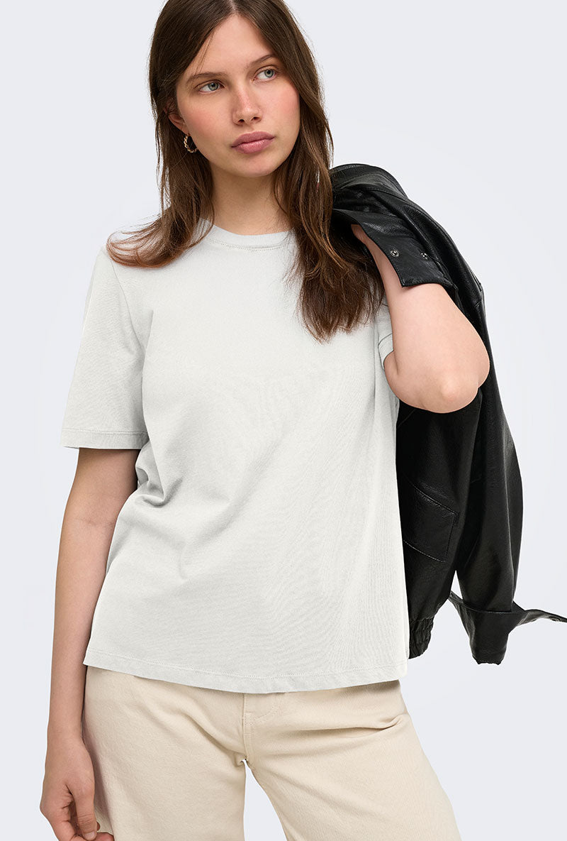 Front image of a model wearing Happy ss oneck tee in off white, by brand Only