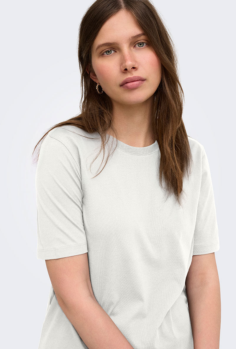 Front image of a model wearing Happy ss oneck tee in off white, by brand Only