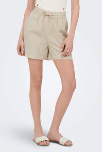 Front image of a model wearing the Jdy say hw linen string shorts in oat, by brand Jacqueline de yong