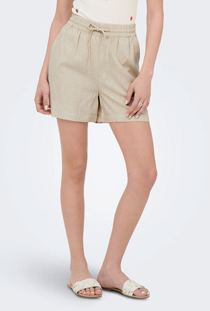 Front image of a model wearing the Jdy say hw linen string shorts in oat, by brand Jacqueline de yong