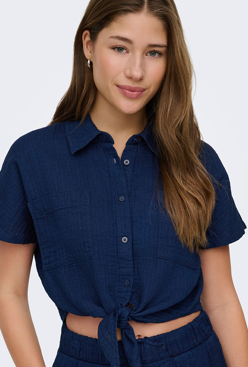 Front image of a model wearing Leoni seersucker cap knot shirt in navy, by brand Only