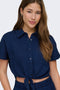 Front image of a model wearing the Leoni seersucker cap knot shirt in navy, by brand Only