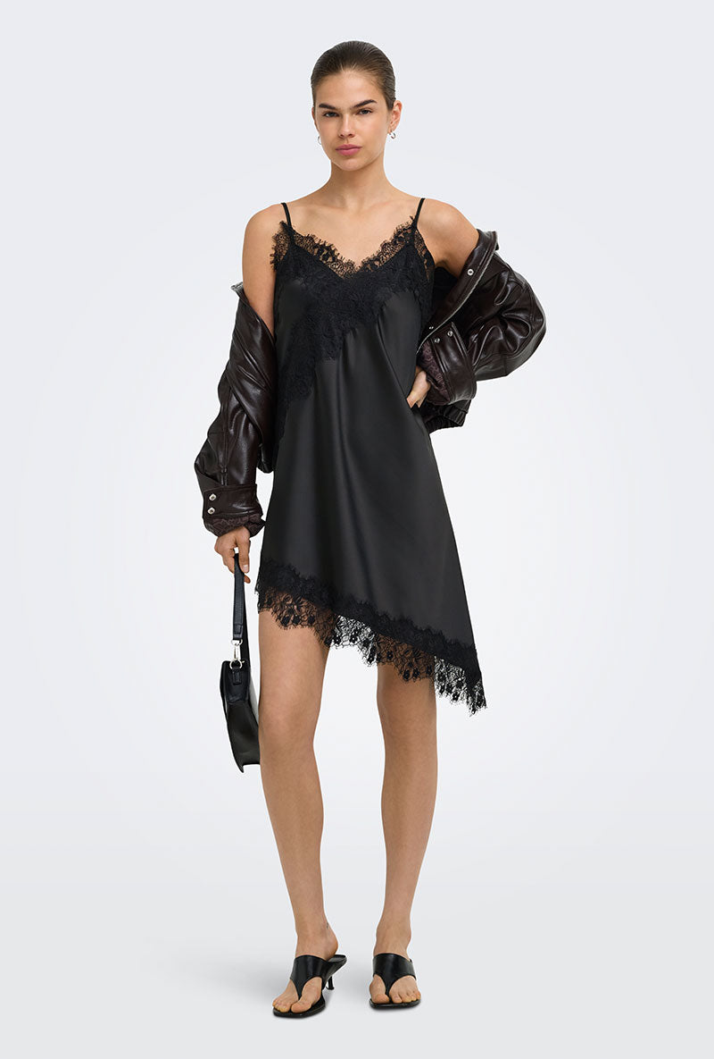 Front image of a model wearing Lindona strap satin lace dress in black, by brand Only