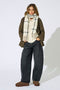 Front image of a model wearing Mathilde check fringe scarf in grey, by brand Only
