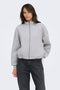 Front image of a model wearing Nadja ls zip sweat in grey, by brand Only