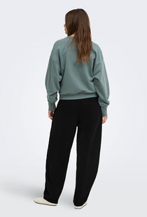 Back image of a model wearing the Ofelia sweatpants in black, by brand Only
