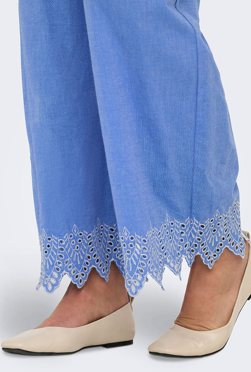 Front detail image of a model wearing Only paula tulum emb trousers in blue, by brand Only