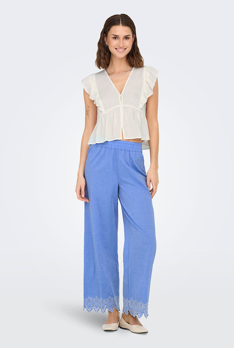 Front image of a model wearing Only paula tulum emb trousers in blue, by brand Only