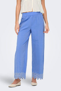 Front image of a model wearing the Only paula tulum emb trousers in blue, by brand Only