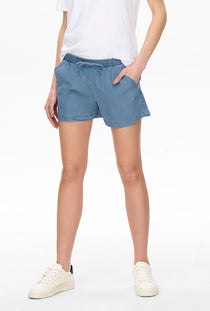 Front image of a model wearing the Pema life lycell denim shorts in denim, by brand Only