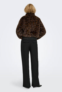 Back image of a model wearing the Rikke faux fur jacket in black, by brand Only