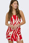 Front image of a model wearing the Sakura short bandeau dress in red, by brand Only