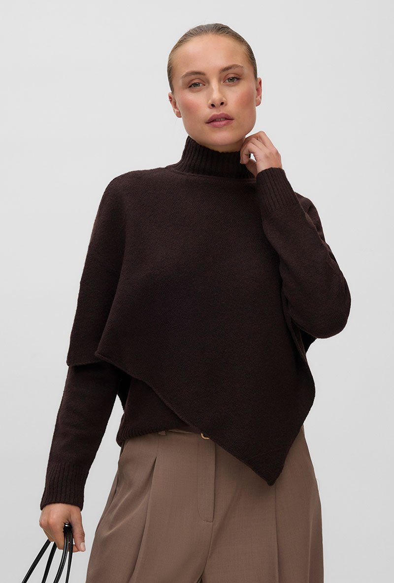 Front image of a model wearing Camila ls cape higneck pullover in chocolate, by brand Vero moda