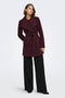 Front image of a model wearing the Trish wrap coat in chocolate, by brand Only
