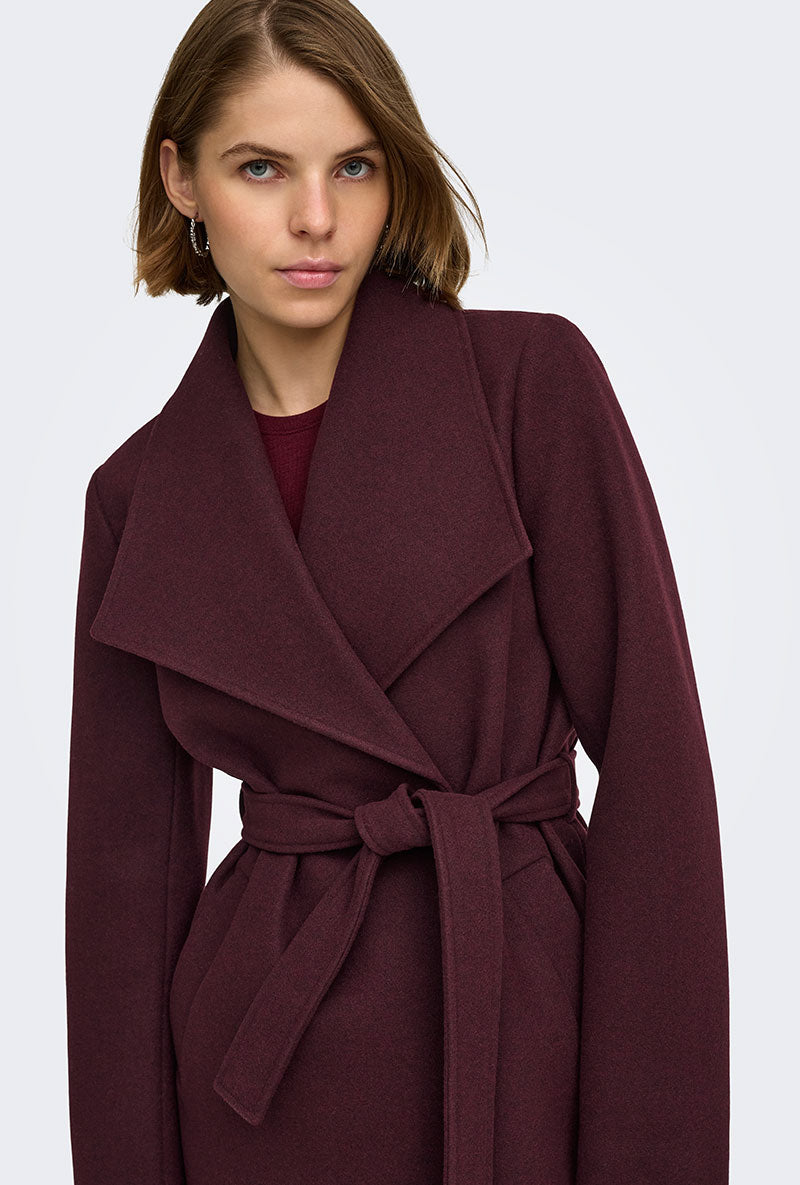 Front image of a model wearing Trish wrap coat in chocolate, by brand Only