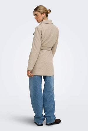 Back image of a model wearing the Trish wrap coat in light brown, by brand Only