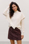 Front image of a model wearing Camila ls cape higneck pullover in cream, by brand Vero moda