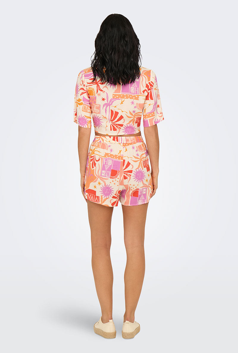Back image of a model wearing Only zuffy life shorts in orange, by brand Only