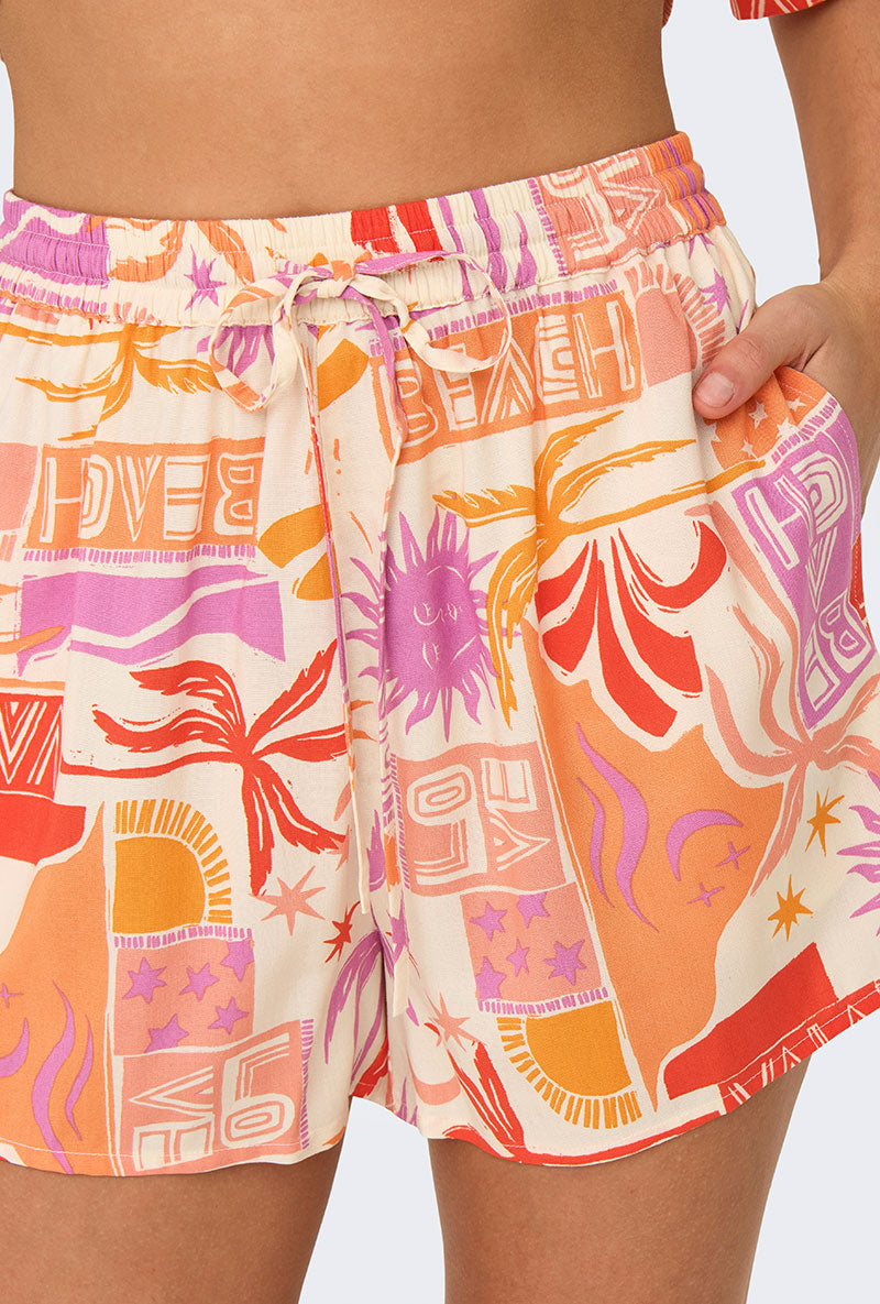 Front image of a model wearing Only zuffy life shorts in orange, by brand Only