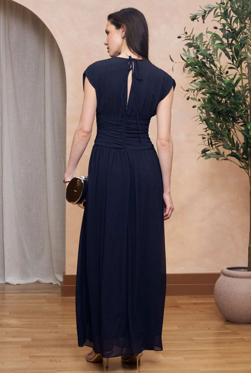 Back image of a model wearing Angelie maxi dress in navy, by brand Tfnc