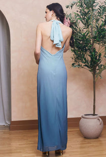 Back image of a model wearing the Casey maxi dress in aqua, by brand Tfnc