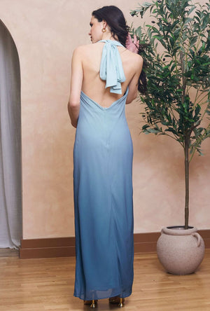 Back image of a model wearing the Casey maxi dress in aqua, by brand Tfnc