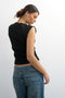 Back image of a model wearing the Adela sl rib boyfriend tank top in black, by brand Top shop