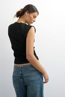 Back image of a model wearing the Adela sl rib boyfriend tank top in black, by brand Top shop
